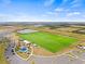Aerial view of a new construction community sports field complex with pond, playgrounds and parking at 5539 Silver Sun Dr, Apollo Beach, FL 33572