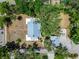 Aerial view of property showcasing lush landscaping, mature trees, and the house's roofline at 5603 Palmetto Rd, New Port Richey, FL 34652