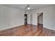 Bedroom with hardwood floors, neutral walls, and access to a closet at 5603 Palmetto Rd, New Port Richey, FL 34652