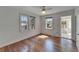 Bright bedroom with hardwood floors, filled with natural light from two windows at 5603 Palmetto Rd, New Port Richey, FL 34652