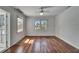 Spacious bedroom with hardwood floors and scenic outdoor views at 5603 Palmetto Rd, New Port Richey, FL 34652