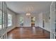 Dining room featuring hardwood floors, chandelier, and built-in cabinets at 5603 Palmetto Rd, New Port Richey, FL 34652