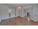 View of dining room with hardwood floors, cabinets, and french doors at 5603 Palmetto Rd, New Port Richey, FL 34652