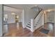 Entryway featuring wood floors, staircase, and access to living areas at 5603 Palmetto Rd, New Port Richey, FL 34652