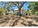 Charming, two-story home nestled among mature trees, offering a serene and private setting at 5603 Palmetto Rd, New Port Richey, FL 34652