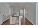 Second-floor hallway boasting hardwood floors and neutral paint at 5603 Palmetto Rd, New Port Richey, FL 34652