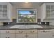 Close up of the kitchen sink with a bright window overlooking the yard at 5603 Palmetto Rd, New Port Richey, FL 34652