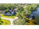 Aerial shot of the property highlighting its location on the water and lush surroundings at 5610 N River Shore Dr, Tampa, FL 33603
