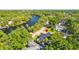 High angle of property nestled in lush greenery with waterfront access and community at 5610 N River Shore Dr, Tampa, FL 33603