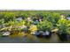 Aerial of home with access to waterways and multiple docks and boat slips at 5610 N River Shore Dr, Tampa, FL 33603