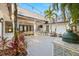 Spacious backyard deck featuring an outdoor bar, BBQ, dining table, and lush landscaping at 5610 N River Shore Dr, Tampa, FL 33603