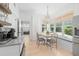 Cozy breakfast nook with cushioned bench seating and a view of the yard at 5610 N River Shore Dr, Tampa, FL 33603
