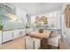 Dining room featuring a wooden table and views into the kitchen at 5610 N River Shore Dr, Tampa, FL 33603