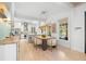 Stylish dining room with modern lighting adjacent to a well-appointed kitchen at 5610 N River Shore Dr, Tampa, FL 33603