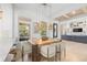 Elegant dining room featuring a modern light fixture and beautiful outdoor view at 5610 N River Shore Dr, Tampa, FL 33603