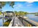 Beautiful waterfront dock with boat and seating area providing relaxing outdoor space at 5610 N River Shore Dr, Tampa, FL 33603