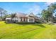 Charming two-story home with well-manicured lawn and a covered front porch at 5610 N River Shore Dr, Tampa, FL 33603