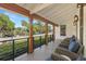 Cozy porch with views of the water, offering a relaxing outdoor space at 5610 N River Shore Dr, Tampa, FL 33603