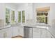 Bright kitchen sink area with a large window, offering scenic outdoor views at 5610 N River Shore Dr, Tampa, FL 33603