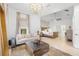 Inviting living room connected to the bedroom featuring elegant lighting and a comfortable seating area at 5610 N River Shore Dr, Tampa, FL 33603