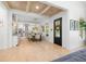 Open floor plan featuring a dining area and living room with hardwood floors and neutral decor at 5610 N River Shore Dr, Tampa, FL 33603