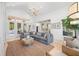Spacious living room features a large sofa and water views at 5610 N River Shore Dr, Tampa, FL 33603