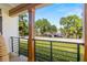 Outdoor porch with railing, wooden posts and water views at 5610 N River Shore Dr, Tampa, FL 33603