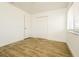Bedroom featuring neutral paint, closet, and tile flooring at 5670 Postma St, North Port, FL 34287