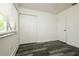 Bedroom with sleek, dark-toned wood flooring and bright window at 5670 Postma St, North Port, FL 34287