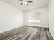 Cozy bedroom featuring neutral paint, a ceiling fan, and vinyl flooring at 5670 Postma St, North Port, FL 34287