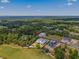 Aerial view of a newly-constructed home on a large lot surrounded by trees at 5865 Creek Ridge Rd, Brooksville, FL 34601