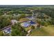 Aerial view of the property highlighting its expansive lot size, landscaping, and surrounding neighborhood at 5865 Creek Ridge Rd, Brooksville, FL 34601
