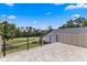 This tiled balcony overlooks a golf course and the surrounding greenery at 5865 Creek Ridge Rd, Brooksville, FL 34601