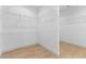 Spacious walk-in closet featuring built-in shelving, providing ample storage space at 5865 Creek Ridge Rd, Brooksville, FL 34601