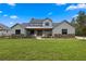 Charming two-story home with a landscaped front yard, stone accents, and a welcoming front porch at 5865 Creek Ridge Rd, Brooksville, FL 34601