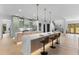Gourmet kitchen featuring double islands, pendant lighting, and access to the staircase at 5865 Creek Ridge Rd, Brooksville, FL 34601