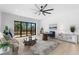 Bright living room filled with natural light, showcasing modern furnishings and an outdoor deck at 5865 Creek Ridge Rd, Brooksville, FL 34601
