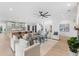 Bright, open living space with modern decor and seamless flow to the kitchen and staircase at 5865 Creek Ridge Rd, Brooksville, FL 34601