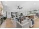 An open living room extends to an outdoor seating area, and boasts an attractive kitchen at 5865 Creek Ridge Rd, Brooksville, FL 34601