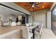 Covered outdoor dining area with elegant table and chairs, ideal for al fresco meals and entertaining at 5865 Creek Ridge Rd, Brooksville, FL 34601