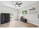 Bright bedroom with wood floors and natural light streaming through windows at 640 Kenneth Way, Tarpon Springs, FL 34689
