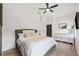 Cozy bedroom features modern wood-look flooring and neutral decor at 640 Kenneth Way, Tarpon Springs, FL 34689