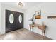 Inviting entryway features wood-look floors and decorative double doors at 640 Kenneth Way, Tarpon Springs, FL 34689