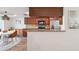 Stylish kitchen with stainless steel appliances, tiled backsplash, and lots of cabinets for storage at 640 Kenneth Way, Tarpon Springs, FL 34689