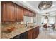 Kitchen features granite countertops, stainless steel appliances, and tile backsplash at 640 Kenneth Way, Tarpon Springs, FL 34689