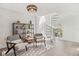 Cozy living room with spiral stairs, wood-look flooring, decor, a light fixture and a large window at 640 Kenneth Way, Tarpon Springs, FL 34689
