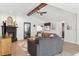 Bright open-concept living room featuring wood-look flooring, sofas, tv, a fireplace and open sightlines at 640 Kenneth Way, Tarpon Springs, FL 34689