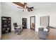 Spacious office with beamed ceiling, modern light fixture, built-in bookcase, and wood-look flooring at 640 Kenneth Way, Tarpon Springs, FL 34689