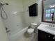 Standard bathroom with a tub-shower combo, toilet, and vanity sink at 6405 Osprey Lake Cir, Riverview, FL 33578