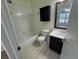 Well-lit bathroom featuring a vanity, and shower and tub combo at 6405 Osprey Lake Cir, Riverview, FL 33578
